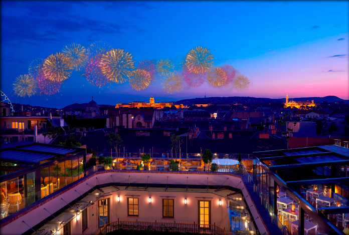 Fireworks above a rooftop bar courtyard